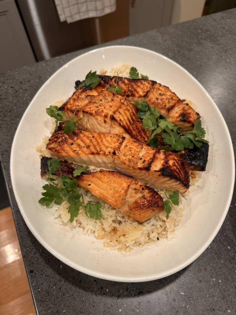 Family-style salmon over rice for a private dinner