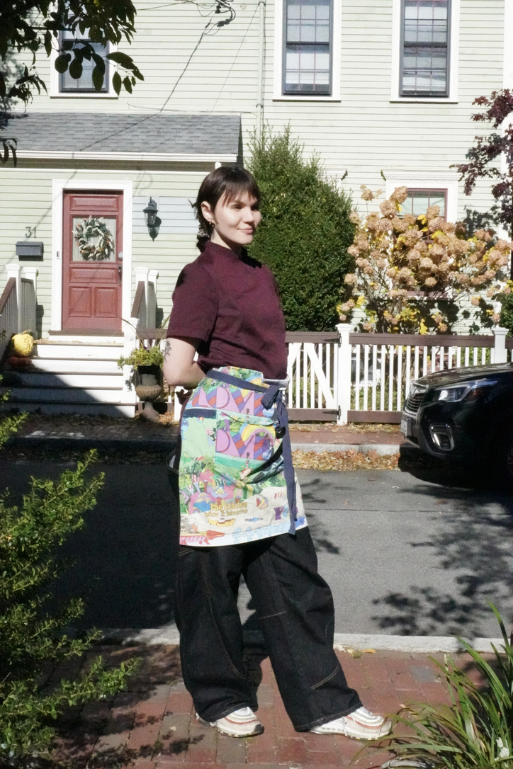 Heloisa Serantoni in chef coat and colorful apron